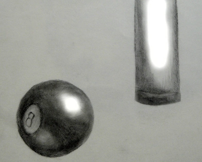 An eight ball from billards, and a queue tip, pencil and paper