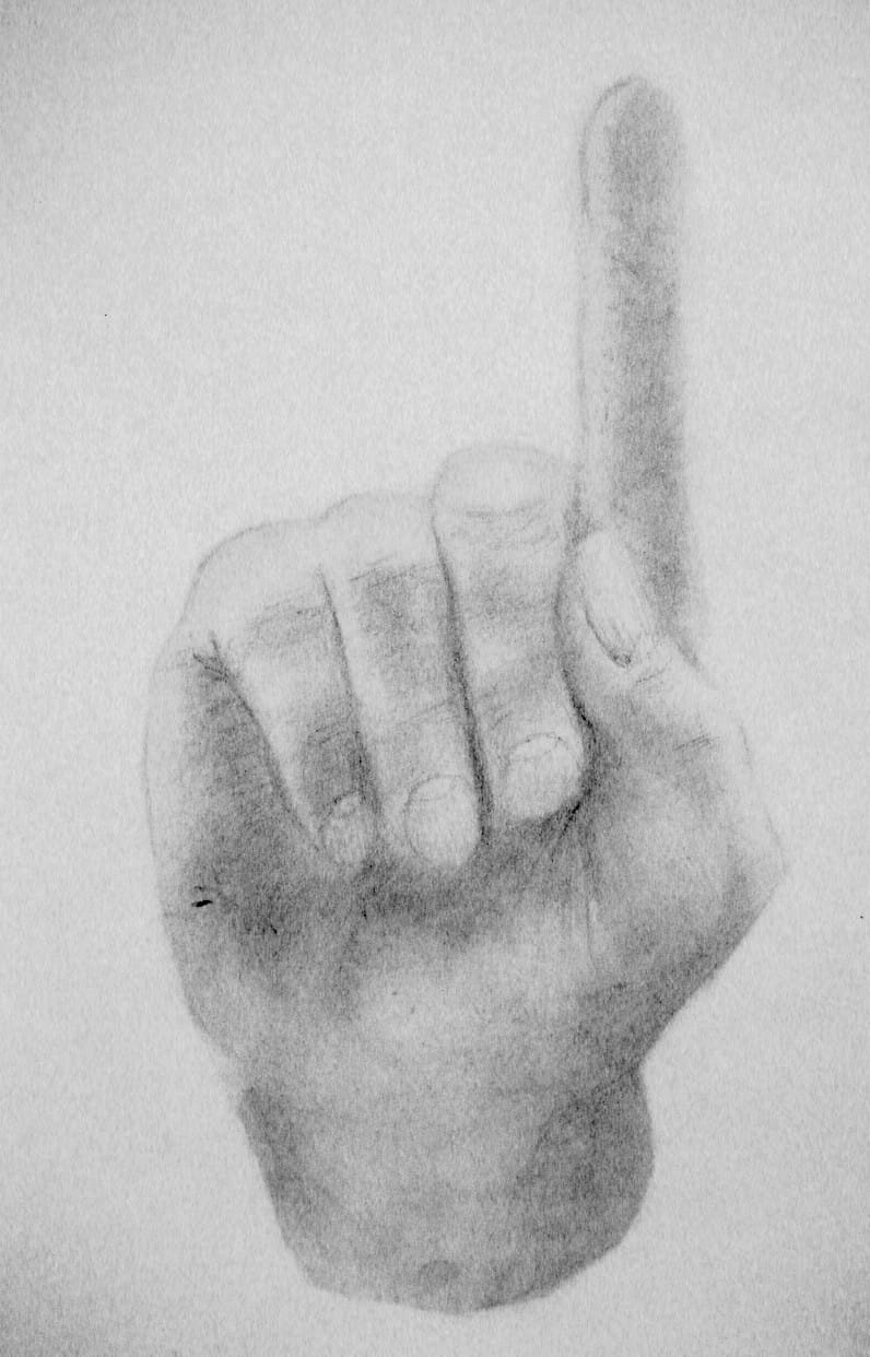 A hand with a pointing finger, pencil and paper